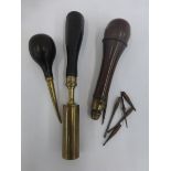 Three late 19th Century/early 20th Century wooden handled hand held tools, one with screw top