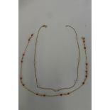 A 9ct gold and coral beaded necklace and a 9ct gold and seed pearl necklace.