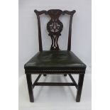 An 18th Century Chippendale style mahogany splat back dining chair with a well carved top rail and