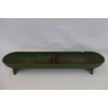 A cast metal feeding trough, the stamp Ransomes Sims and Jefferies Ipswich.