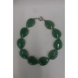 A ten stone tear shaped jade necklace, each stone measuring 1 1/4 inches x 1 1/2 inches, total