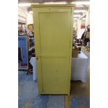 A painted 19th Century/ early 20th Century school cupboard, the single door enclosing four