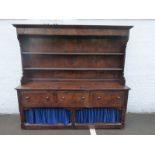 A Bylaw oak 'pembroke' dresser of large proportions, the upper section of two plate shelves with