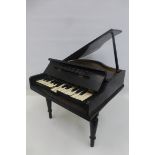 A Fairylite baby grand piano.