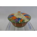 A Clarice Cliff Newport Pottery Bizarre Crocus pattern butter dish and lid (some surface wear).