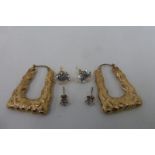 Three pairs of 9ct gold earrings including a pair of 9ct gold hooped and two pairs of CZ solitaire