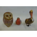 A Royal Crown Derby robin, gold stopper, barn owl, silver stopper, and a 1998 pelican.