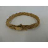 An 18ct gold rope twist bracelet stamped 750, weight 21.4g.