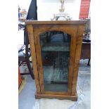 A Victorian walnut and boxwood strung glazed cabinet.