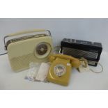 A Bush radio, a Dynatron Elite radio and a 1970s telephone.