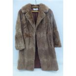 A J.Baker, Colwyn Bay, tan three quarter length fur coat.