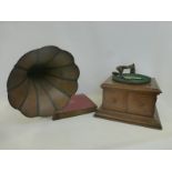 A His Master's Voice oak cased table top gramophone with horn and a folder of 78s.