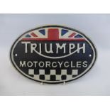 A cast metal wall mounted oval motorbike plaque.