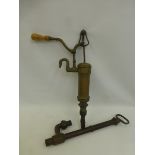 A 19th Century brass stand water pump with turned wooden handle, stamped F.& W. Pontifex, Wood