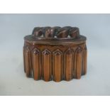 A Victorian copper jelly mould stamped CM 200 1/2.
