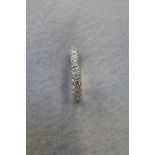 An 18ct white gold and diamond half eternity ring, size N.