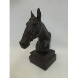 A bust of a thoroughbred race horse.