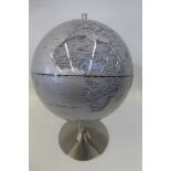 A decorative globe on a stand.