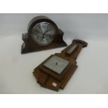 An oak Art Deco banjo style barometer with fahrenheit and centigrade thermometer and an oak cased