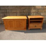 A pine lidded blanket box and a single drawer open fronted side cabinet.