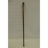 A white metal (possibly silver) knop walking cane.