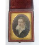 A leather and velvet lined photo case with miniature portrait depicting an Elizabethan lady on