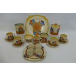 A Clarice Cliff Newport and Wilkinson harlequin Bizarre Crocus pattern four setting breakfast set,