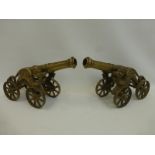 A pair of Chinese/Oriental desk top models of cannons of large proportions.