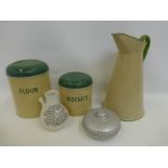 A 1950s cylindrical flour lidded pot, a similar one for biscuits, an enamel water jug, a Nelson's