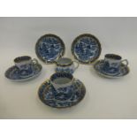 Three 19th Century Davenport coffee cans, six saucers and a cream jug.