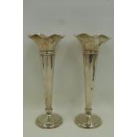 A pair of tall silver trumpet vases by Walker & Hall, Sheffield 1906.