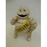 A cast metal figure of Mr Bibendum.