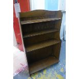 An oak open fronted bookcase with adjustable shelves.