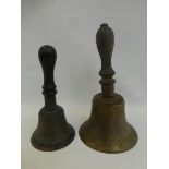 Two 19th Century brass school bells with turned wooden handles.