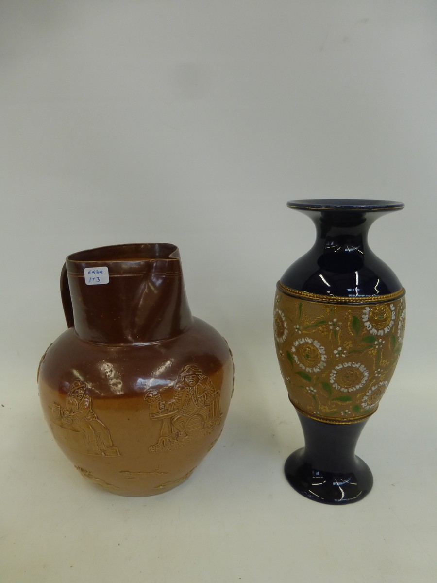 An early 20th Century Royal Doulton vase and a Doulton Lambeth harvest jug.