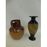 An early 20th Century Royal Doulton vase and a Doulton Lambeth harvest jug.