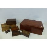 An assortment of wooden lidded boxes of various ages.