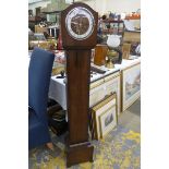 An Art Deco oak cased grandmother clock, inscribed Bentima to the face, with striking movement.