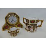 A Royal Crown Derby Old Imari 1128 mantel clock, a Royal Crown Derby twin handled loving cup No.