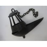 An 18th Century bronze oil lamp with hanging chain.