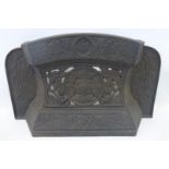 A Victorian cast metal fire grate guard decorated with a Tudor rose and doves Regd. no. to the