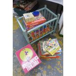 An assortment of children's annuals, board games and a doll etc.