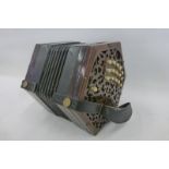 A late 19th Century Lachenal 31 button concertina with six fold bellows with label Lachenal & Co,