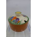 A Clarice Cliff Newport Pottery Reg. No. 748856 Crocus pattern preserve pot and lid (chip to
