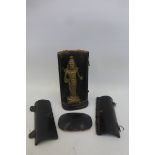 A cased bronzed temple god with travelling wooden case.