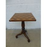 A mahogany and walnut chess table raised on a later tripod base.