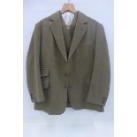 A gentleman's four piece tweed suit comprising jacket, waist-coat, plus fours and trousers by Tom