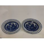 A pair of 19th Century blue and white oval ribbon border plates.