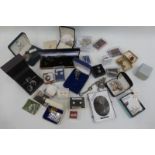 An assortment of silver jewellery including a sliver charm bracelet, earrings, cornelian ring etc.