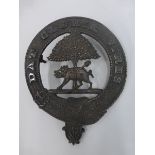 A cast metal Scottish clan badge probably the Hogg Clan) Inscribed DAT GLORIA VIRAS around the edge,